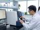 Aegean Labs scientist conducting HPLC analysis in a modern lab, showcasing precision in peptide testing.