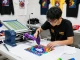Vibrant t-shirt printing singapore workshop with custom designs and skilled printer.