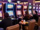 Slot gacor players enjoying a thrilling experience at vibrant casino machines.